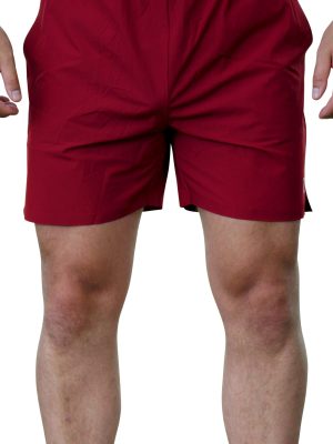 A person wearing Rush Shorts - Crimson Force, with arms slightly bent at the sides. The image is cropped below the chest and above the knees, showing part of their torso and both legs.
