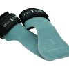 The IronHide Lifting Straps are teal suede lifting grips with black straps, white stitching, and feature white text branding. Designed to protect your hands during weightlifting.