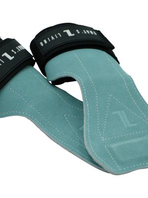 The IronHide Lifting Straps are teal suede lifting grips with black straps, white stitching, and feature white text branding. Designed to protect your hands during weightlifting.