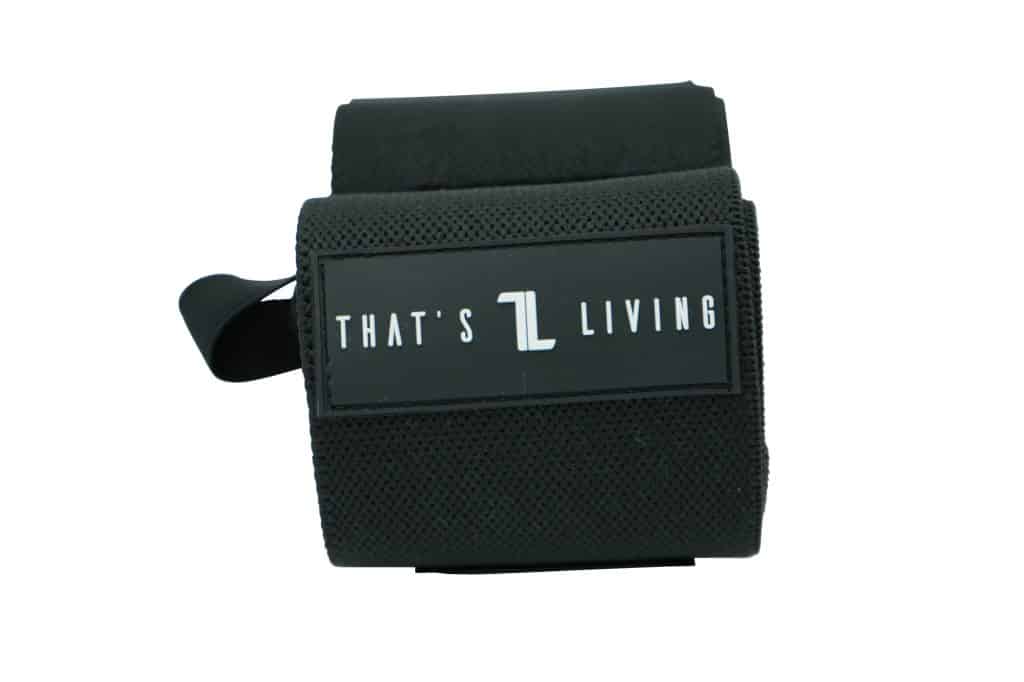 Original Wrist Wraps in black fabric, featuring a rectangular label with "THAT'S L LIVING" in white letters, shown on a white background.