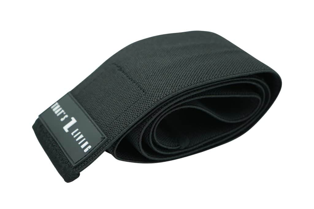 A black, textured fabric band called Original Elbow Wraps is rolled up, featuring a rectangular label with “LIMIT 1 LIVING” in white text on one end.