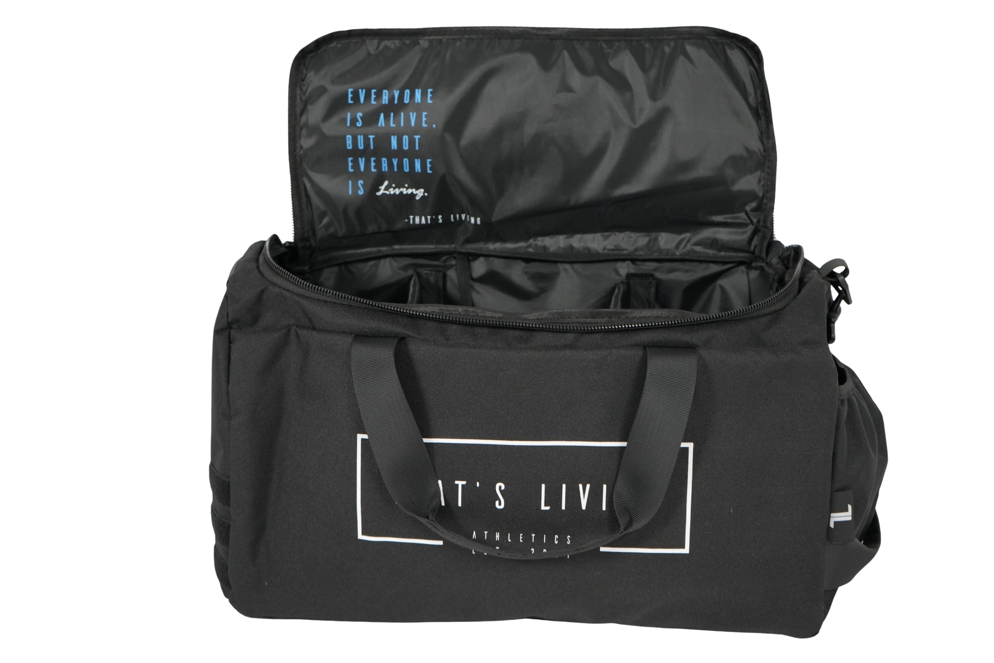 The TRIARC Duffle Bag is black with its top unzipped, revealing the interior. The lid displays the quote "Everyone is alive, but not everyone is living." The front pocket features partial white text.