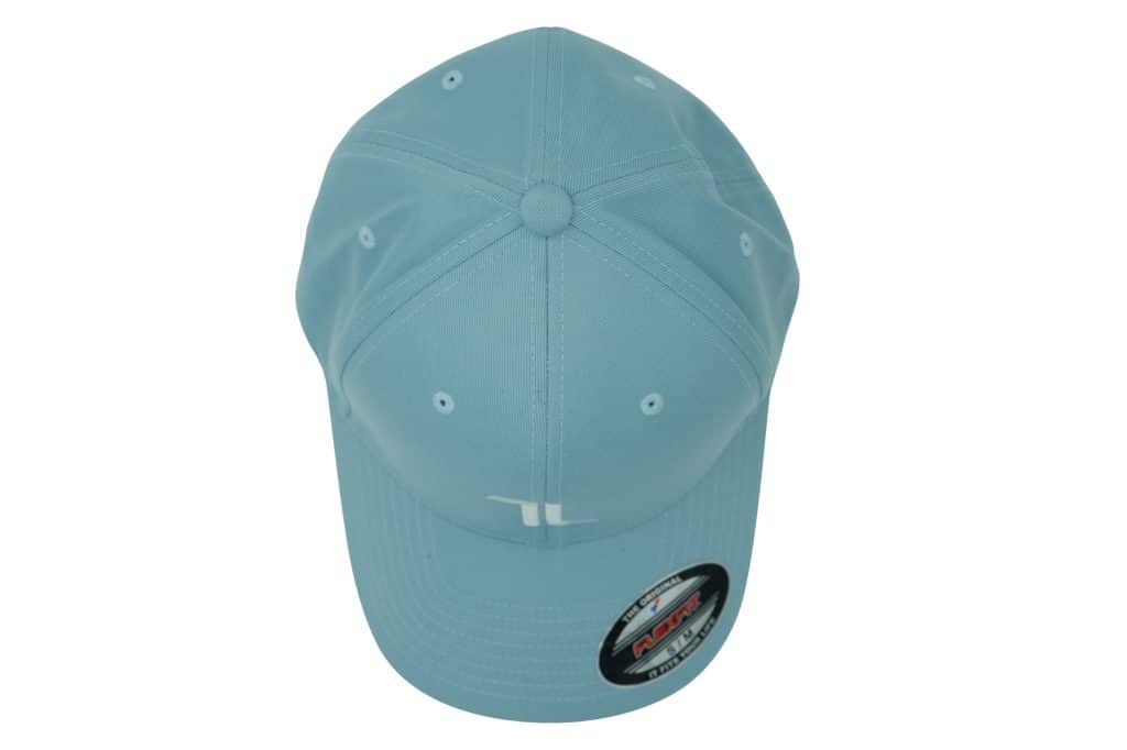 The Original Ball Cap in light blue, viewed from above, features a small white logo on the front and a circular sticker on the brim.