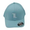A light blue baseball cap with a white stylized "TL" logo on the front, viewed from the front. There is a black and red Flexfit sticker on the brim.