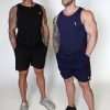 Two muscular men wear Genesis Tank V2 tops and shorts against a plain background. The left man wears black with grey sneakers; the right wears navy with black sneakers.