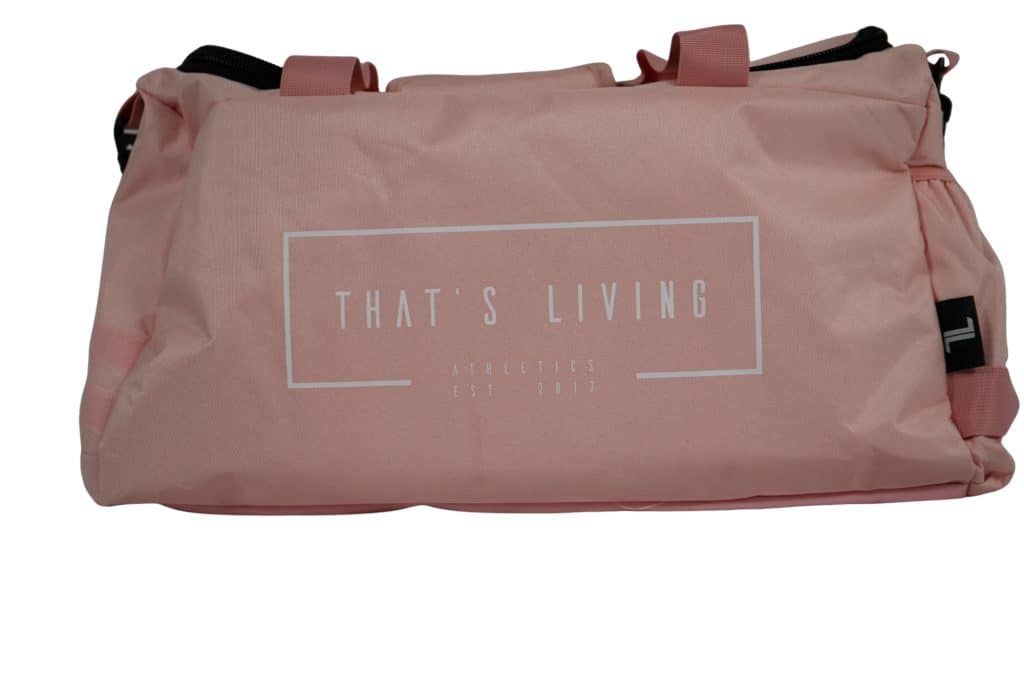 The TRIARC Duffle Bag is a pink duffel with handles, featuring "THAT'S LIVING ATHLETICS EST 2017" printed in white on the front.